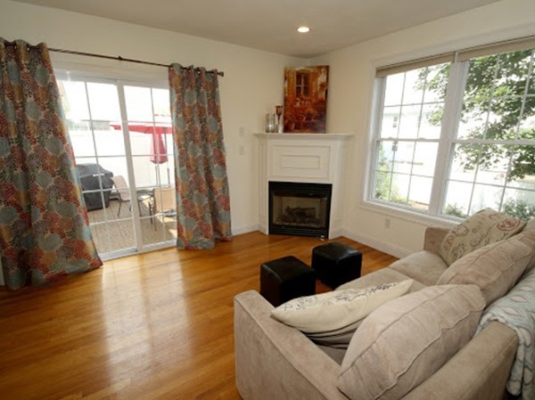 5 Melvin Street, Unit B Wakefield, MA 01880 - Photo 14 of 28 a living room with furniture and a fireplace