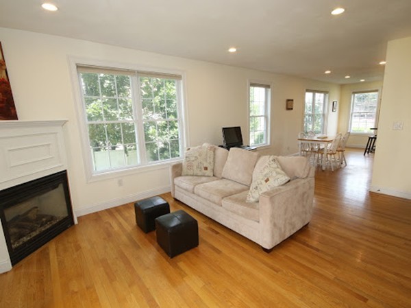 5 Melvin Street, Unit B Wakefield, MA 01880 - Photo 15 of 28 a living room with furniture and a fireplace