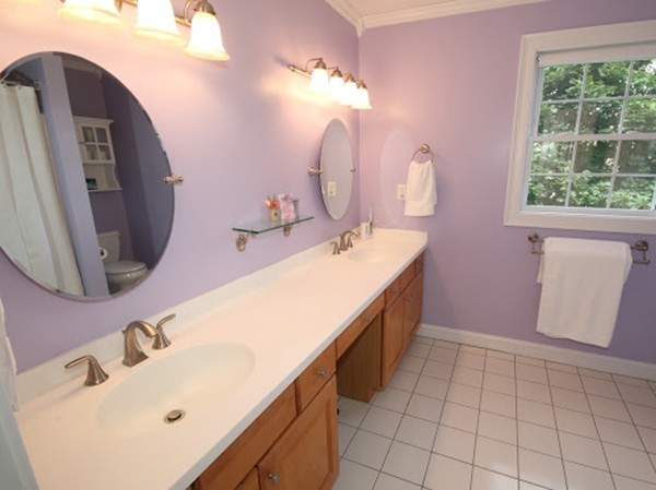 5 Melvin Street, Unit B Wakefield, MA 01880 - Photo 19 of 28 a bathroom with a sink vanity and a mirror