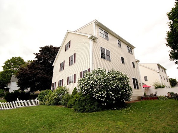 5 Melvin Street, Unit B Wakefield, MA 01880 - Photo 2 of 28 a view of a house with a yard