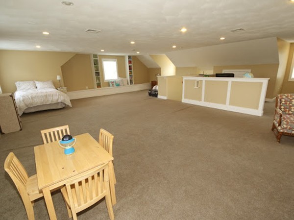 5 Melvin Street, Unit B Wakefield, MA 01880 - Photo 25 of 28 a living room with furniture and a wooden floor