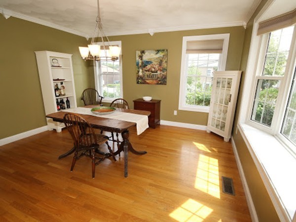 5 Melvin Street, Unit B Wakefield, MA 01880 - Photo 5 of 28 a dining room with furniture a chandelier and wooden floor