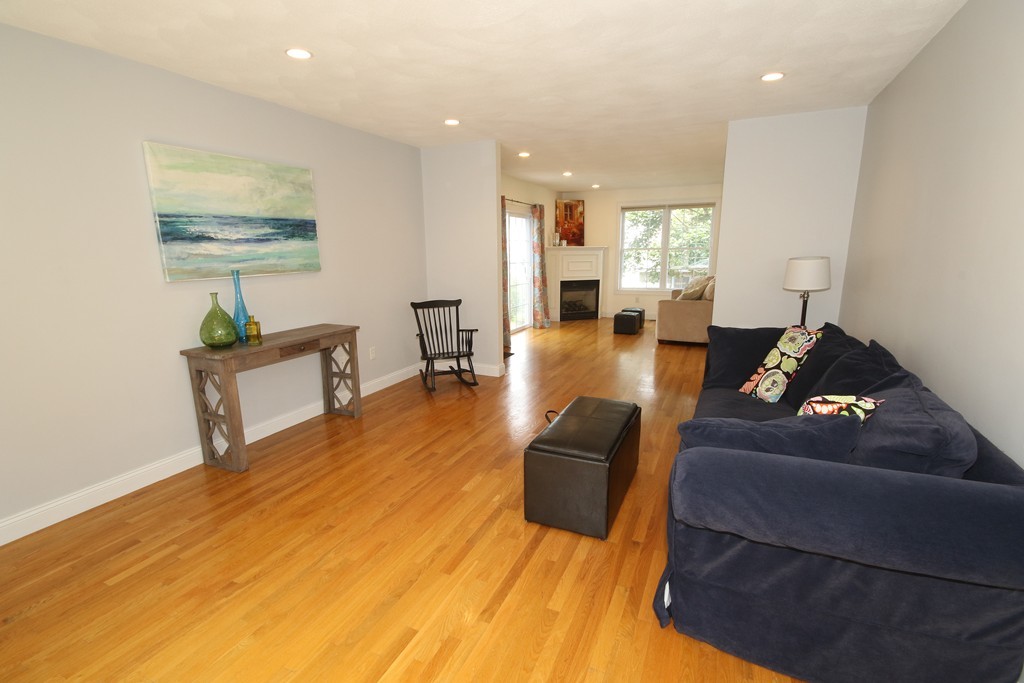 5 Melvin Street, Unit B Wakefield, MA 01880 - Photo 10 of 28 a living room with furniture and a wooden floor