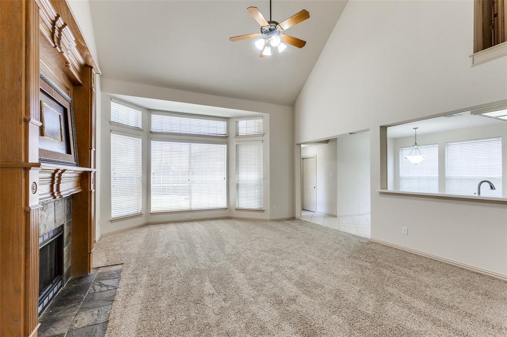 4400 Orchard Gate Lane Plano, TX 75024 - Photo 5 of 12 a view of empty room with window and fireplace