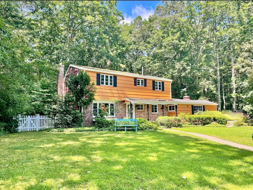 17 Brentwood Road Sudbury, MA 01776 - Photo 2 of 34 a front view of a house with garden and trees