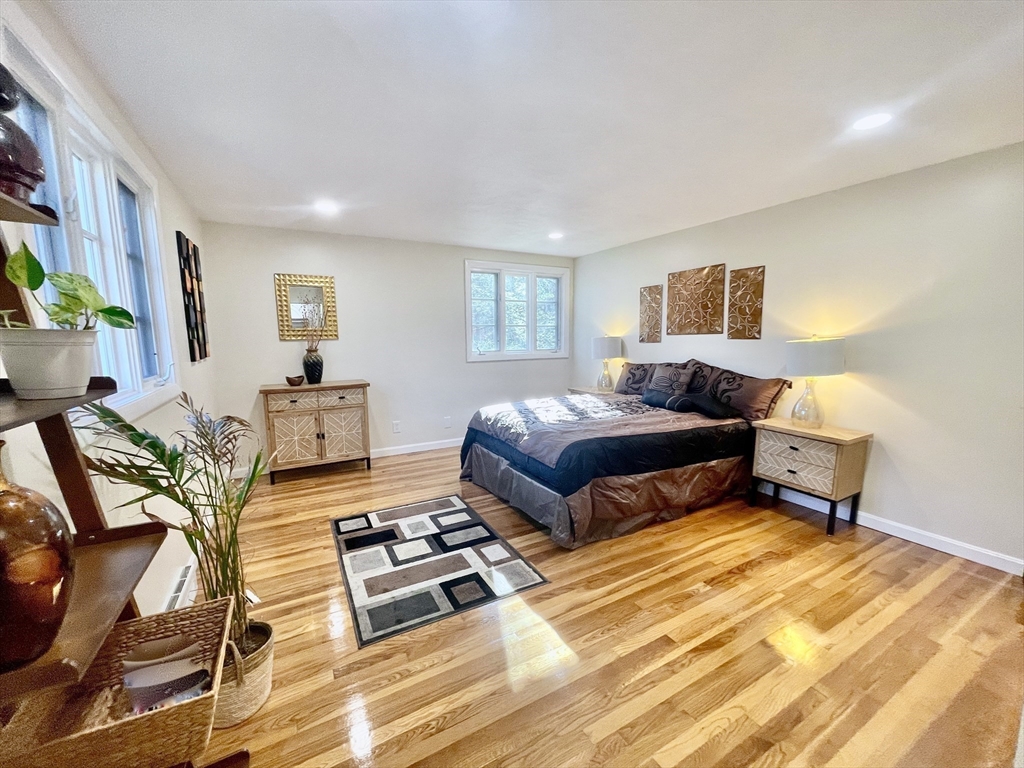 17 Brentwood Road Sudbury, MA 01776 - Photo 21 of 34 a bedroom with a bed a rug and a dresser