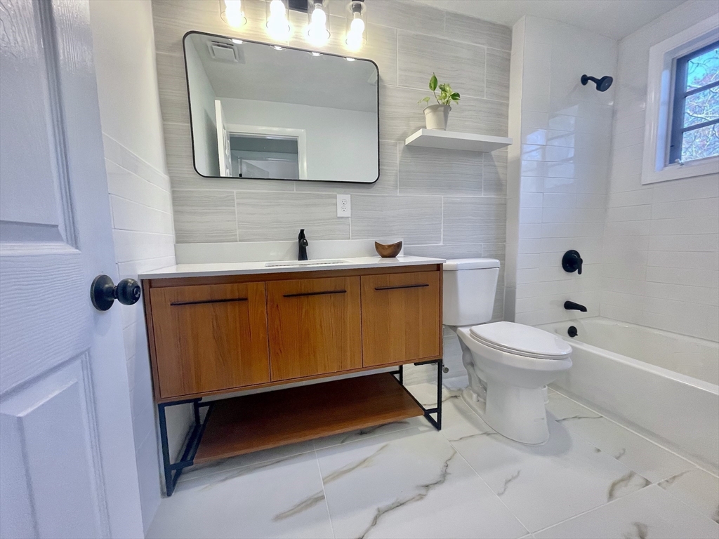 17 Brentwood Road Sudbury, MA 01776 - Photo 23 of 34 a bathroom with a toilet a sink and mirror