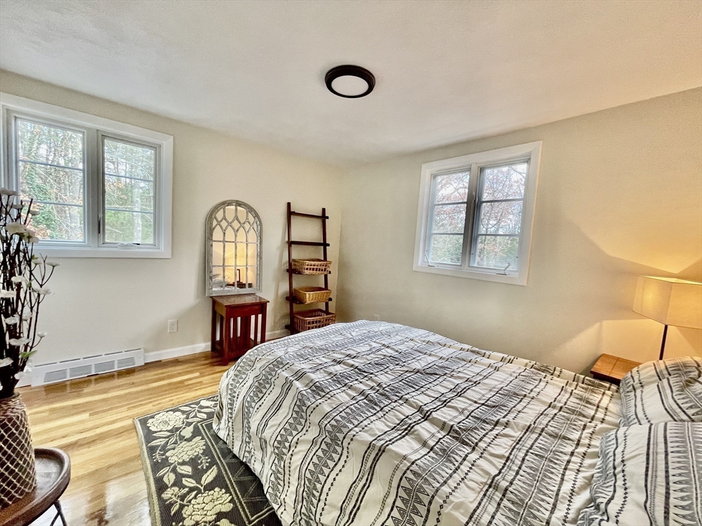 17 Brentwood Road Sudbury, MA 01776 - Photo 27 of 34 a bedroom with a bed dresser and a window