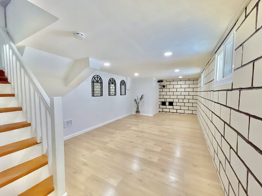 17 Brentwood Road Sudbury, MA 01776 - Photo 28 of 34 a view of entryway and hall with wooden floor