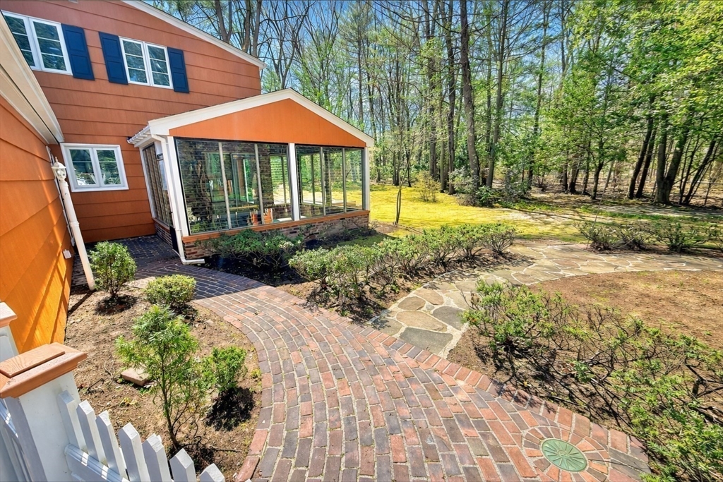 17 Brentwood Road Sudbury, MA 01776 - Photo 32 of 34 a backyard of a house with yard and outdoor seating