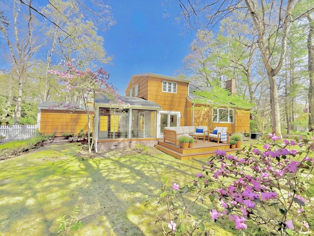 17 Brentwood Road Sudbury, MA 01776 - Photo 4 of 34 a front view of a house with swimming pool and sitting area