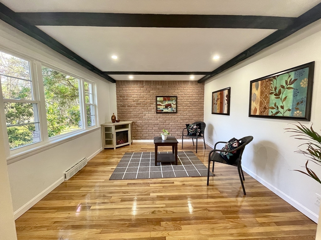 17 Brentwood Road Sudbury, MA 01776 - Photo 5 of 34 a living room with furniture and a rug