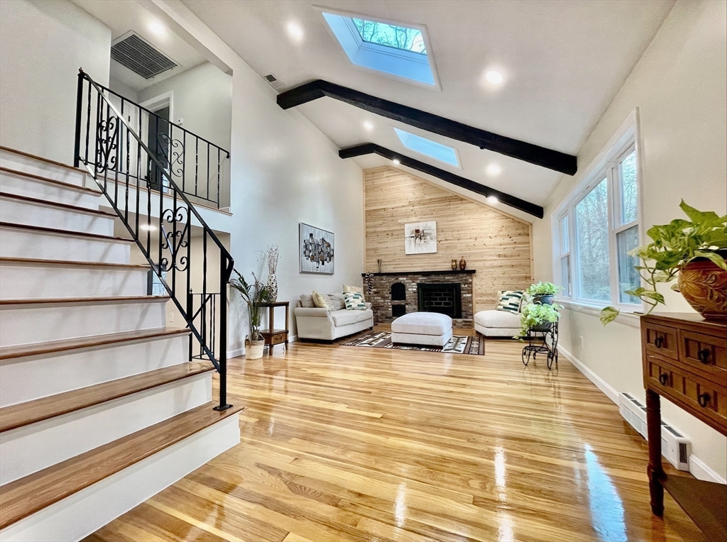 17 Brentwood Road Sudbury, MA 01776 - Photo 7 of 34 a view of livingroom with furniture and staircase