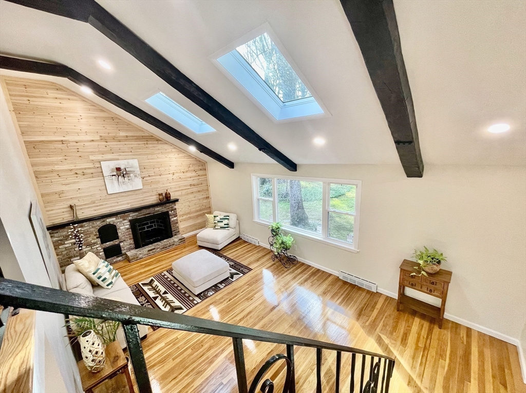 17 Brentwood Road Sudbury, MA 01776 - Photo 10 of 34 a view of a living room and a fireplace