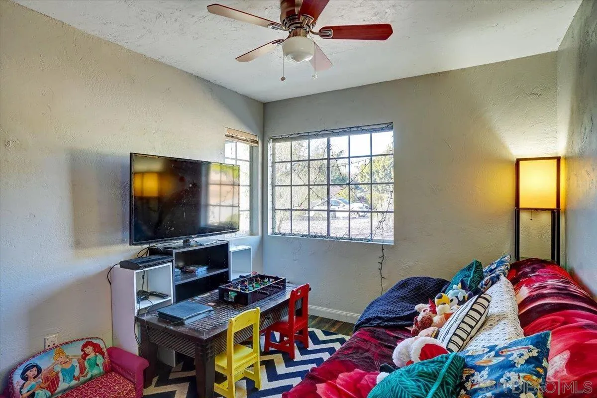 132 Mercedes Road Fallbrook, CA 92028 - Photo 14 of 63 a bedroom with a bed and a window