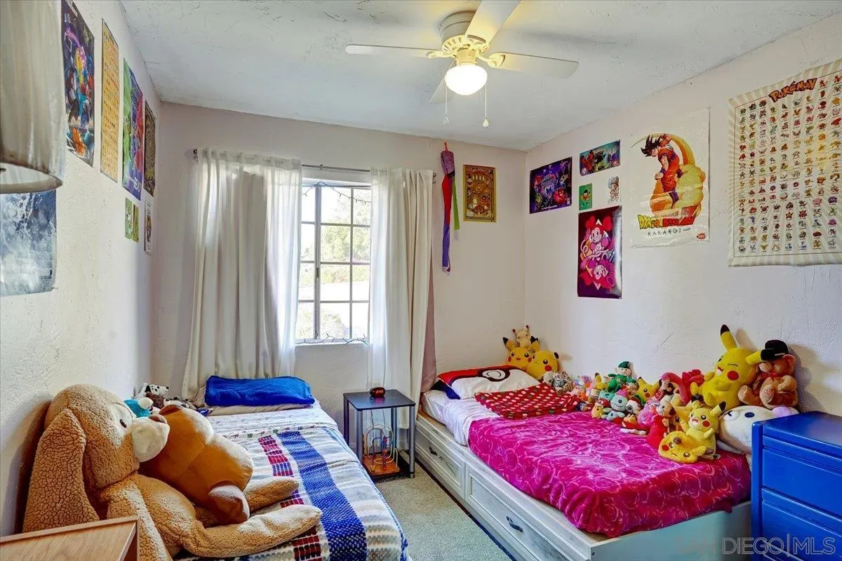 132 Mercedes Road Fallbrook, CA 92028 - Photo 15 of 63 a bedroom with furniture and a bed