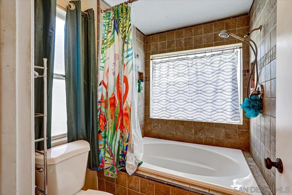 132 Mercedes Road Fallbrook, CA 92028 - Photo 21 of 63 a bathroom with a bathtub and a shower