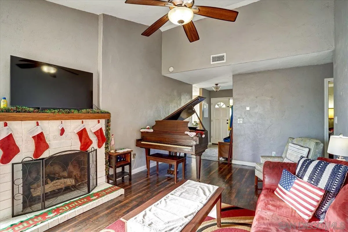 132 Mercedes Road Fallbrook, CA 92028 - Photo 7 of 63 a living room with furniture and a flat screen tv