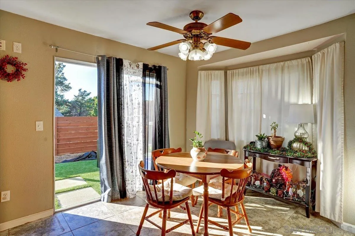 132 Mercedes Road Fallbrook, CA 92028 - Photo 8 of 63 a view of a dining room with furniture window and wooden floor