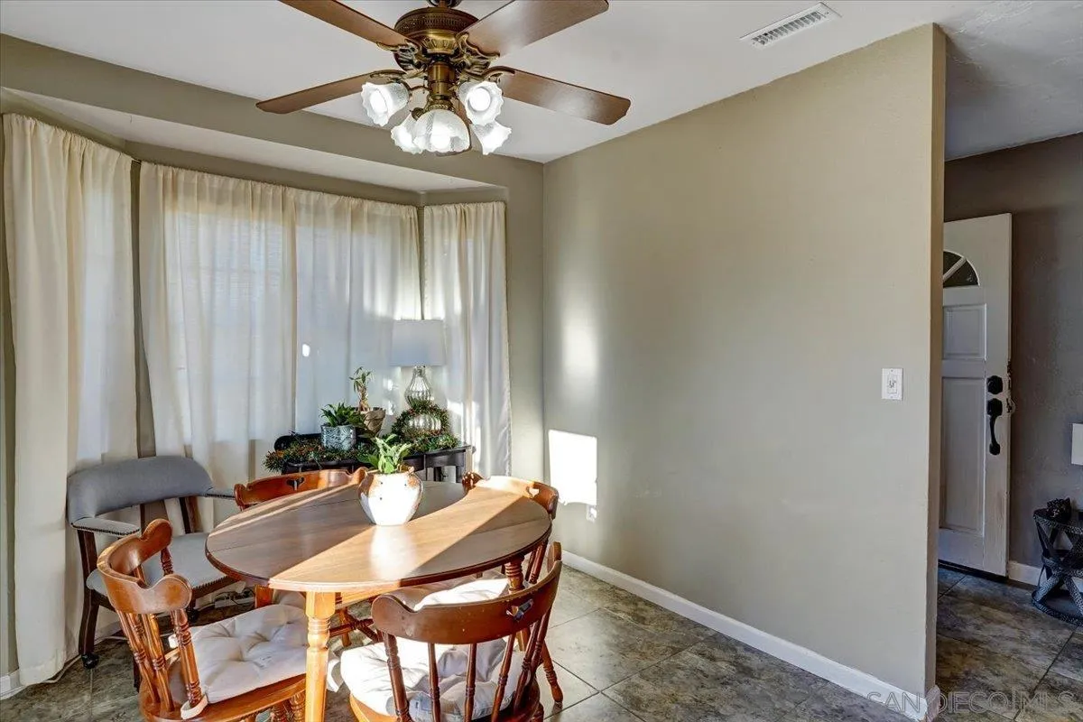 132 Mercedes Road Fallbrook, CA 92028 - Photo 9 of 63 a dining room with furniture and window