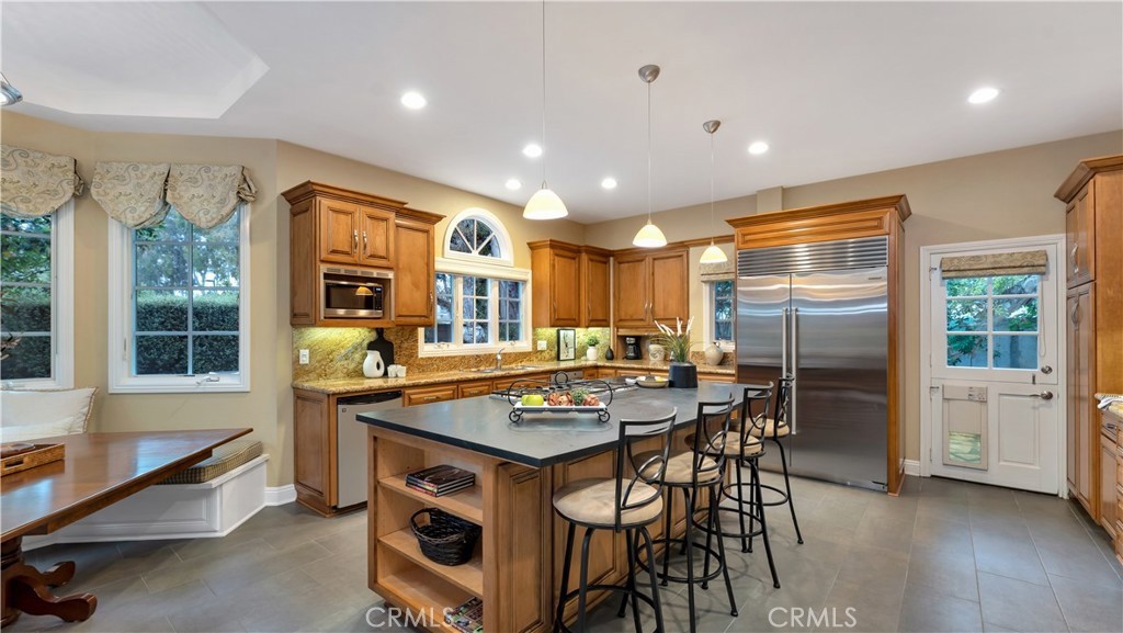 2 Rainstar Irvine, CA 92614 - Photo 12 of 34 a kitchen with stainless steel appliances granite countertop a stove and a refrigerator