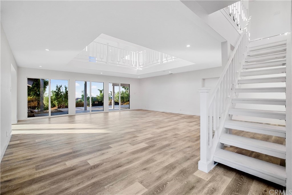 14265 Alva Place Perris, CA 92570 - Photo 21 of 59 a view of an entryway with wooden floor and windows