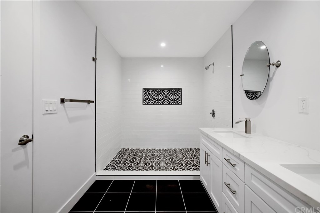 14265 Alva Place Perris, CA 92570 - Photo 30 of 59 a bathroom with a sink a toilet a shower and a mirror