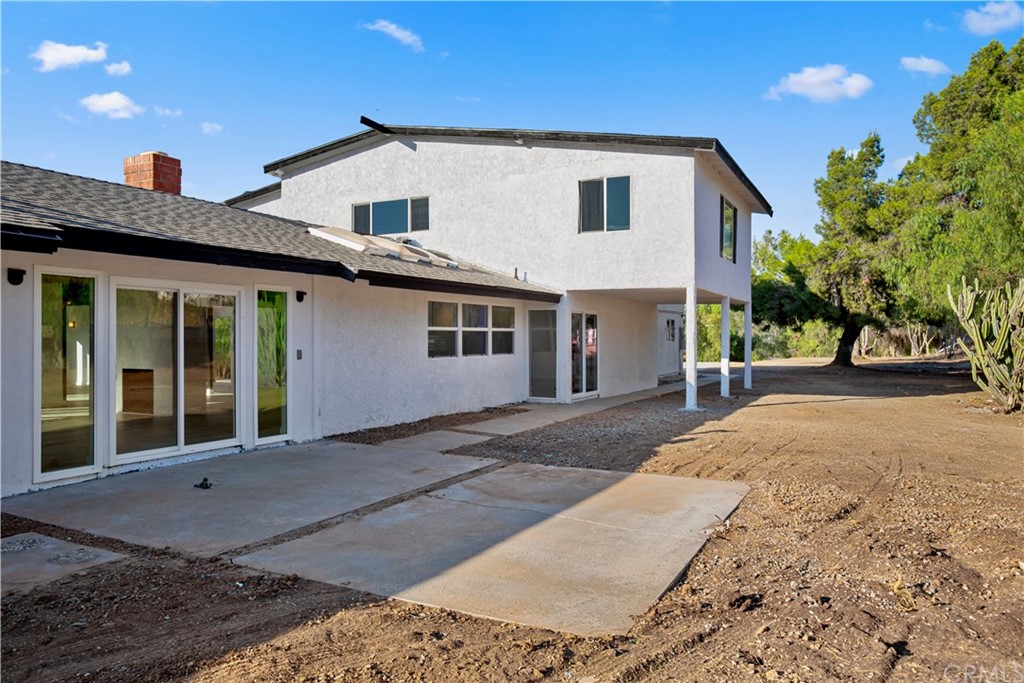14265 Alva Place Perris, CA 92570 - Photo 35 of 59 a front view of a house with a yard and garage