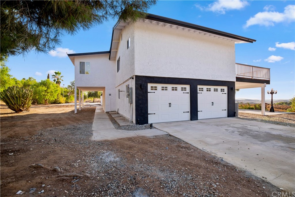 14265 Alva Place Perris, CA 92570 - Photo 36 of 59 a view of a house with a yard