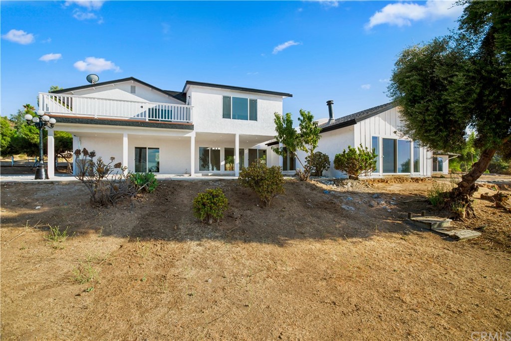14265 Alva Place Perris, CA 92570 - Photo 4 of 59 a front view of a house with a yard