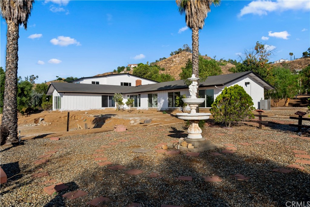14265 Alva Place Perris, CA 92570 - Photo 48 of 59 a front view of a house with garden