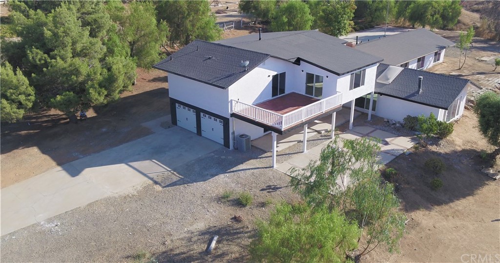 14265 Alva Place Perris, CA 92570 - Photo 59 of 59 an aerial view of a house with a yard and trees