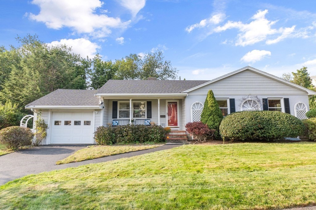 22 Bradley Road Danvers, MA 01923 - Photo 2 of 40 a front view of a house with a yard