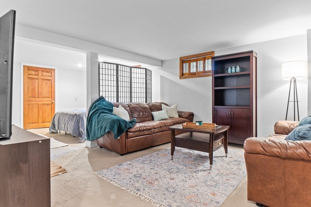 22 Bradley Road Danvers, MA 01923 - Photo 22 of 40 a living room with furniture and a window