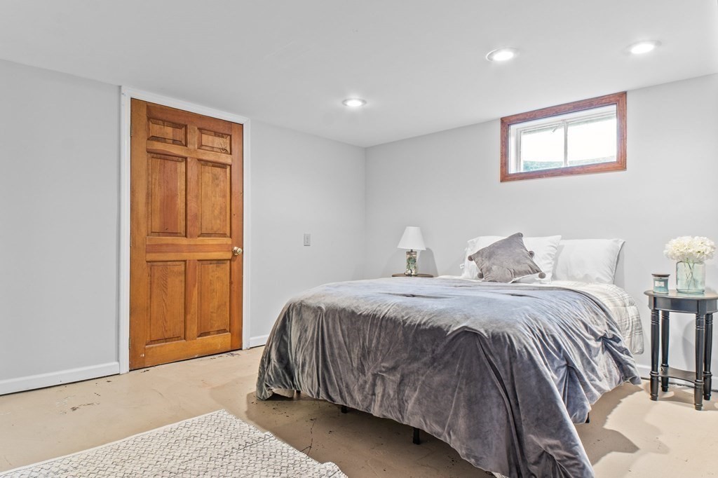 22 Bradley Road Danvers, MA 01923 - Photo 23 of 40 a spacious bedroom with a bed and cabinets