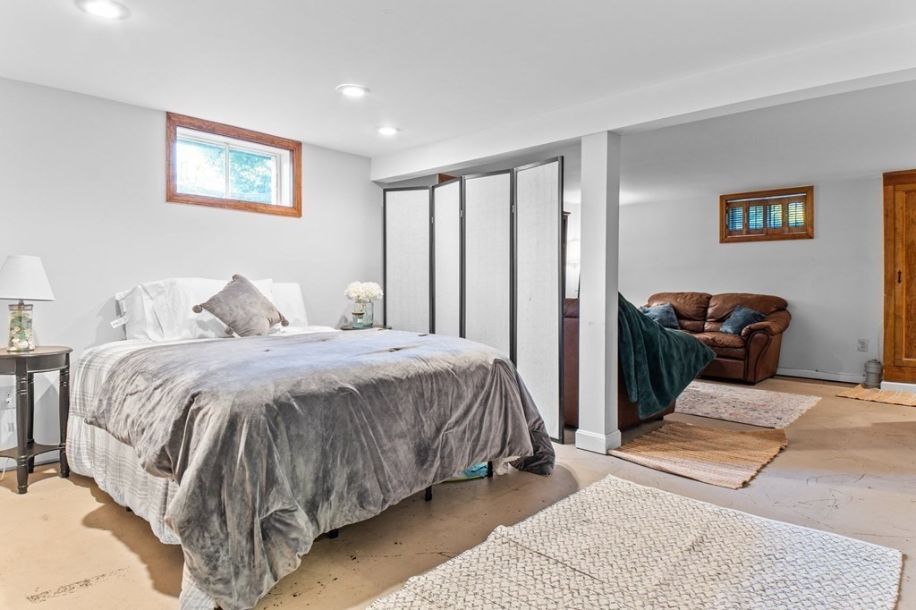 22 Bradley Road Danvers, MA 01923 - Photo 24 of 40 a bedroom with a bed and wooden floor