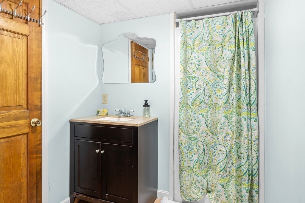 22 Bradley Road Danvers, MA 01923 - Photo 25 of 40 a bathroom with a sink and a mirror