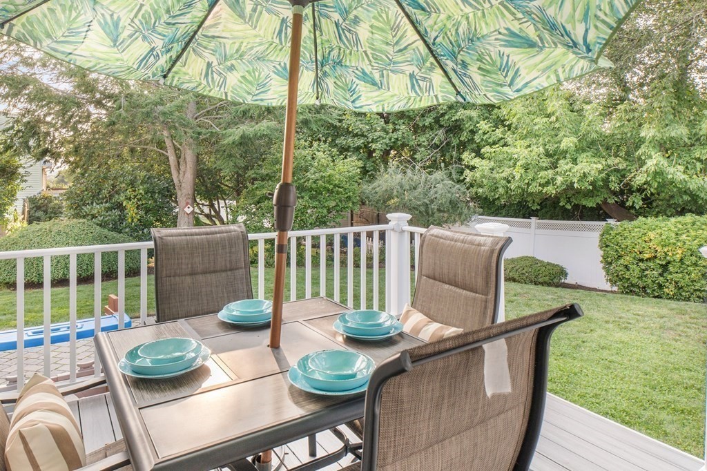 22 Bradley Road Danvers, MA 01923 - Photo 30 of 40 a view of a table and chairs on the roof deck