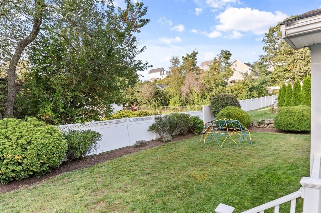 22 Bradley Road Danvers, MA 01923 - Photo 33 of 40 a view of backyard with seating area and green space