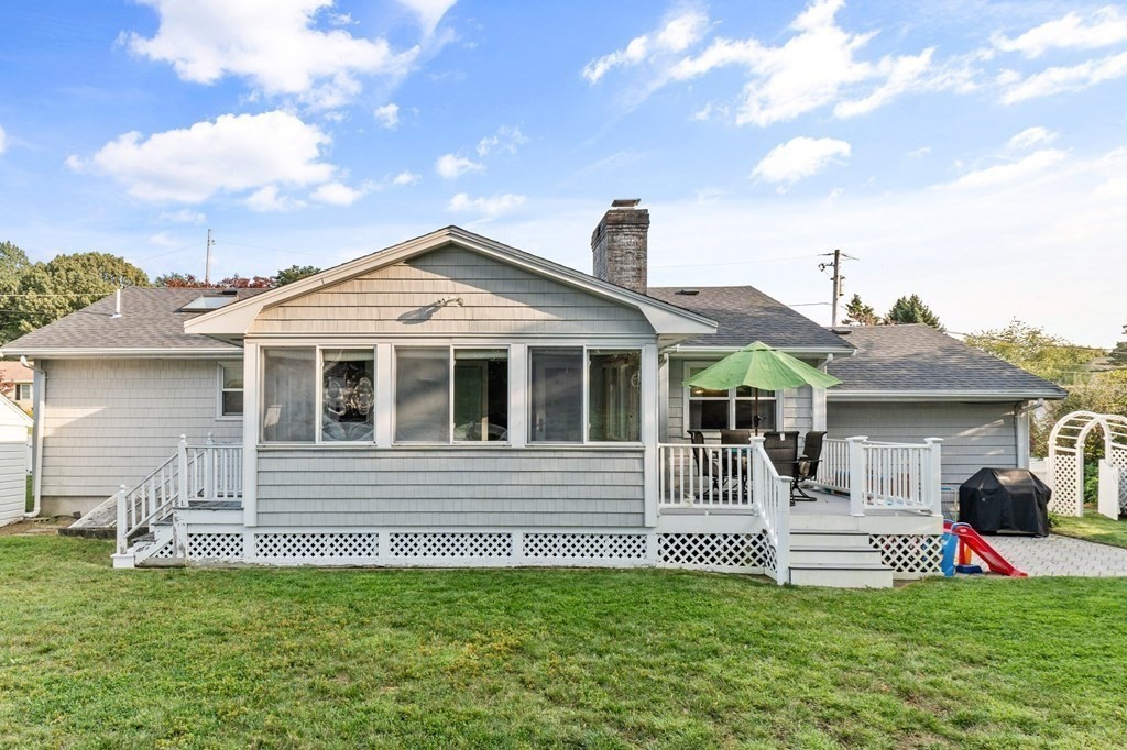 22 Bradley Road Danvers, MA 01923 - Photo 34 of 40 a front view of a house with a garden