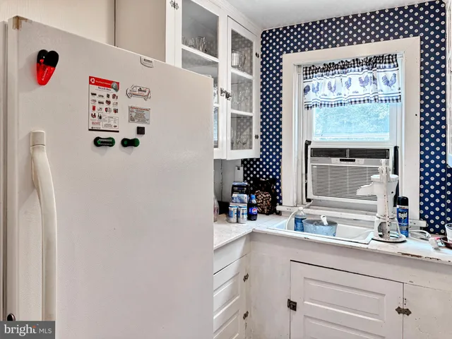 a white cabinet with a white cabinet