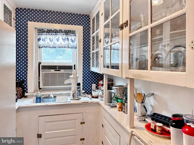 a kitchen with a refrigerator and sink