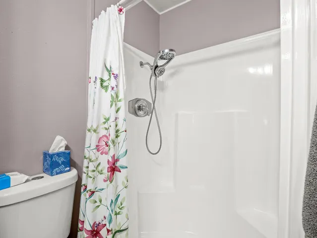 a bathroom with a shower curtain