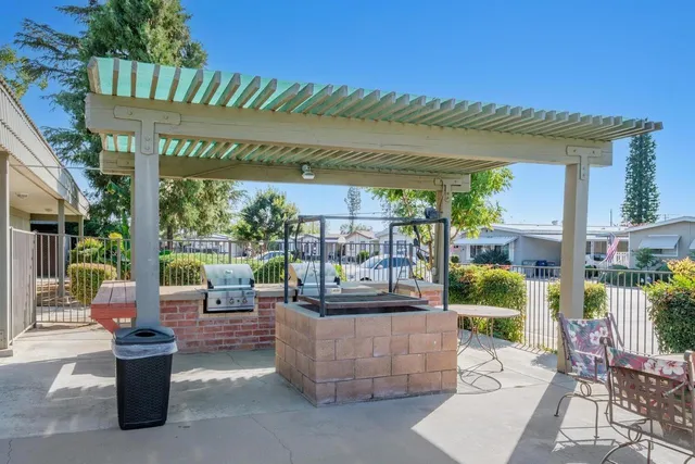 a building outdoor space with patio furniture and potted plants