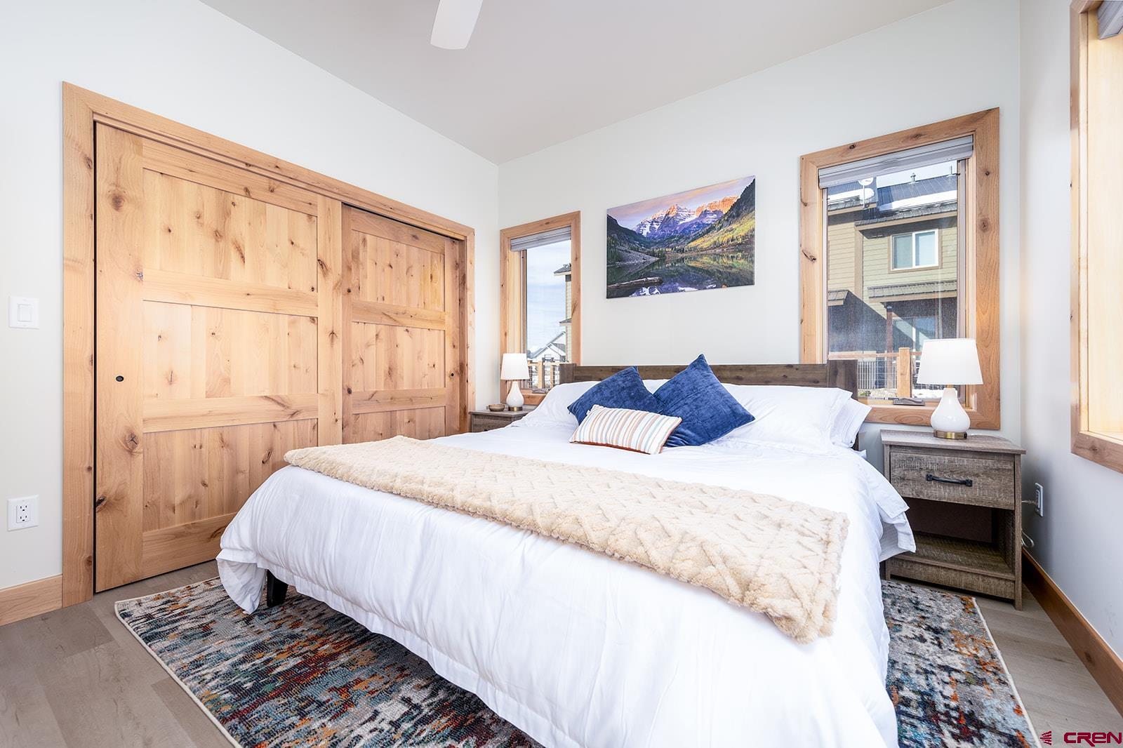 101 Elk Valley Road, Unit A Crested Butte, CO 81224 - Photo 16 of 42 a bedroom with a large bed and a window