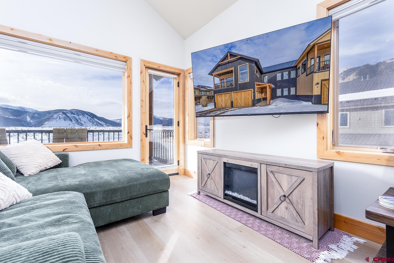 101 Elk Valley Road, Unit A Crested Butte, CO 81224 - Photo 19 of 42 a living room with furniture a fireplace and a window