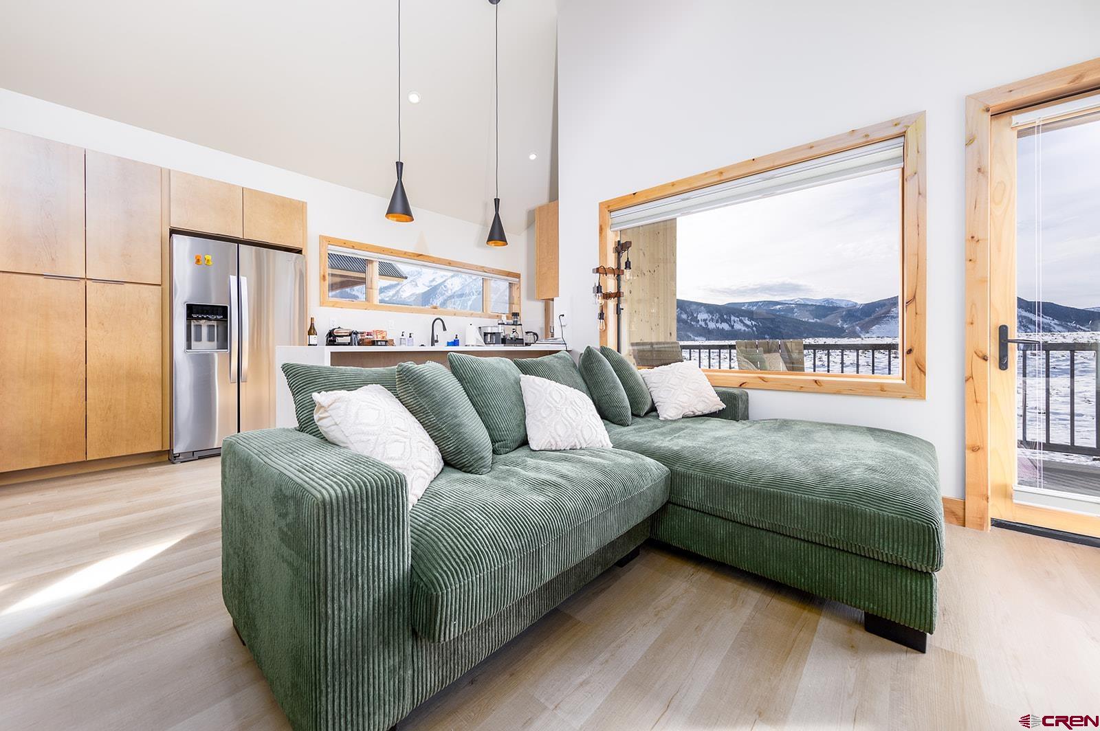 101 Elk Valley Road, Unit A Crested Butte, CO 81224 - Photo 20 of 42 a living room with furniture and a large window