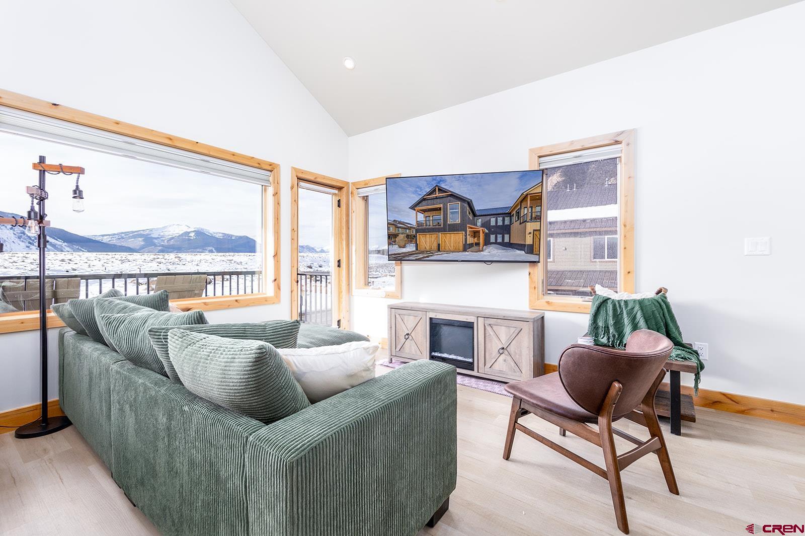 101 Elk Valley Road, Unit A Crested Butte, CO 81224 - Photo 21 of 42 a living room with furniture and a fireplace