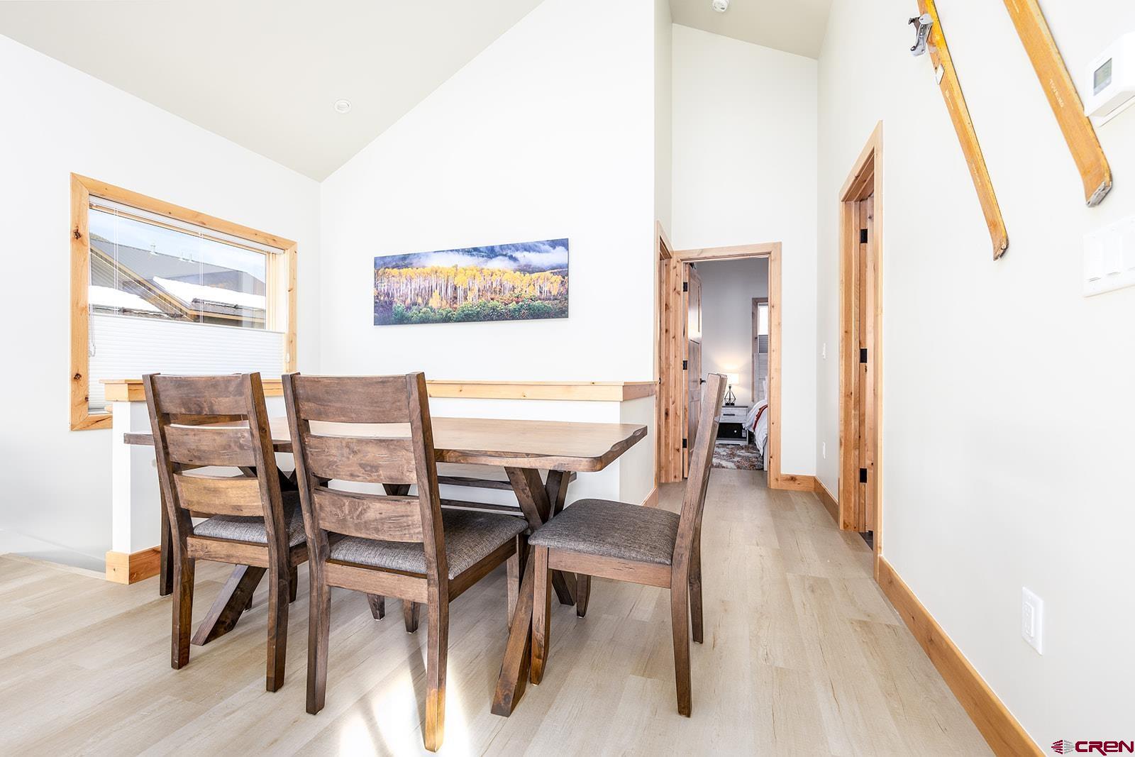 101 Elk Valley Road, Unit A Crested Butte, CO 81224 - Photo 25 of 42 a dining room with furniture and wooden floor
