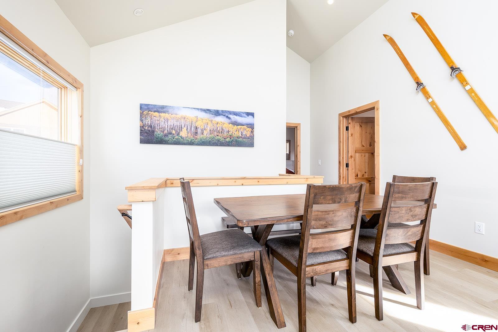 101 Elk Valley Road, Unit A Crested Butte, CO 81224 - Photo 26 of 42 a view of a dining room with furniture and a large window